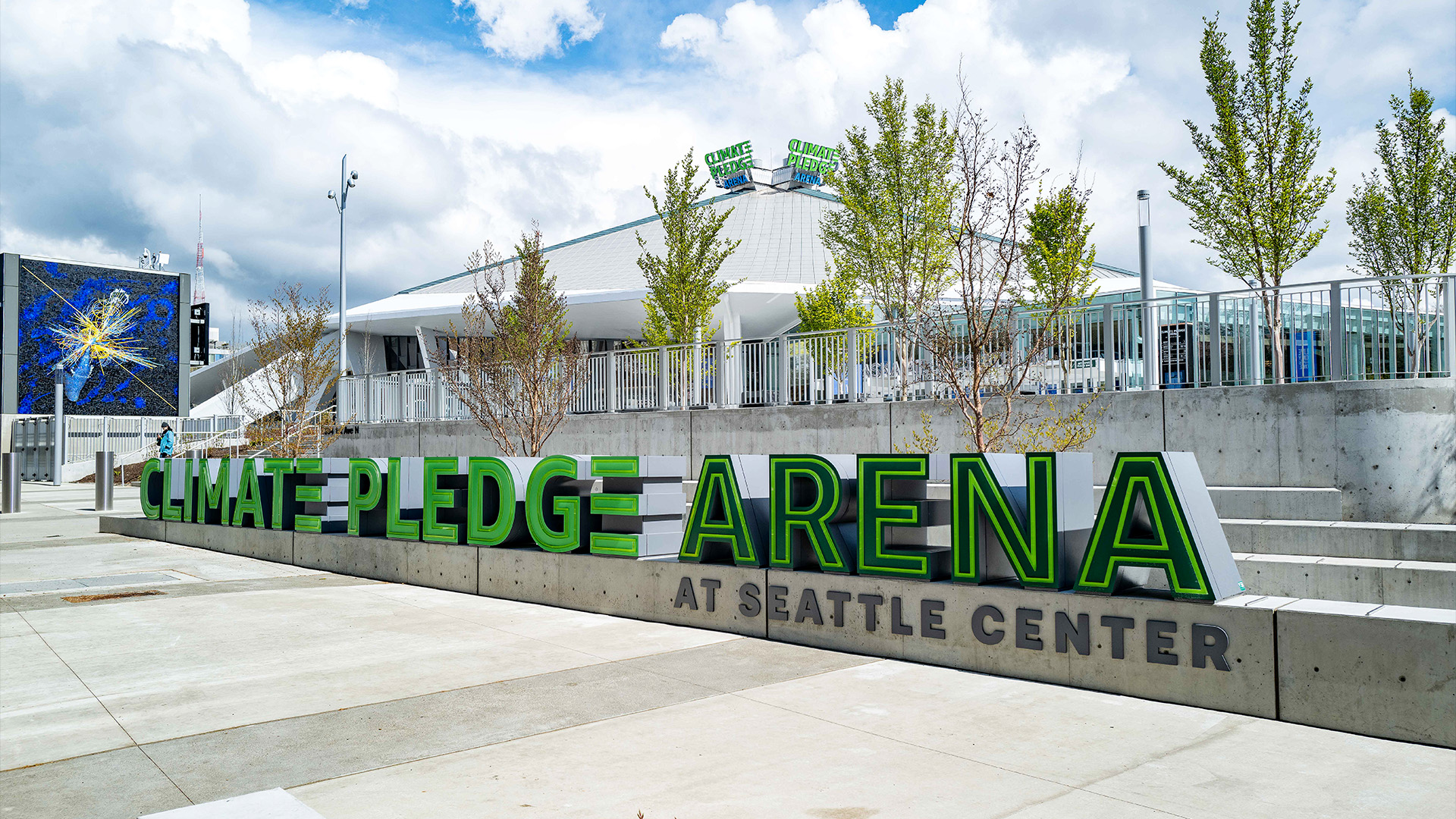 Outdoor photo of the Climate Pledge Arena sign and facility