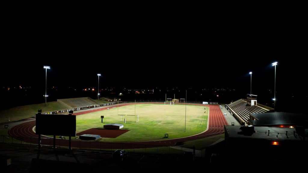 Big Elk Stadium upgrades lit at night with to new sports lighting from Musco