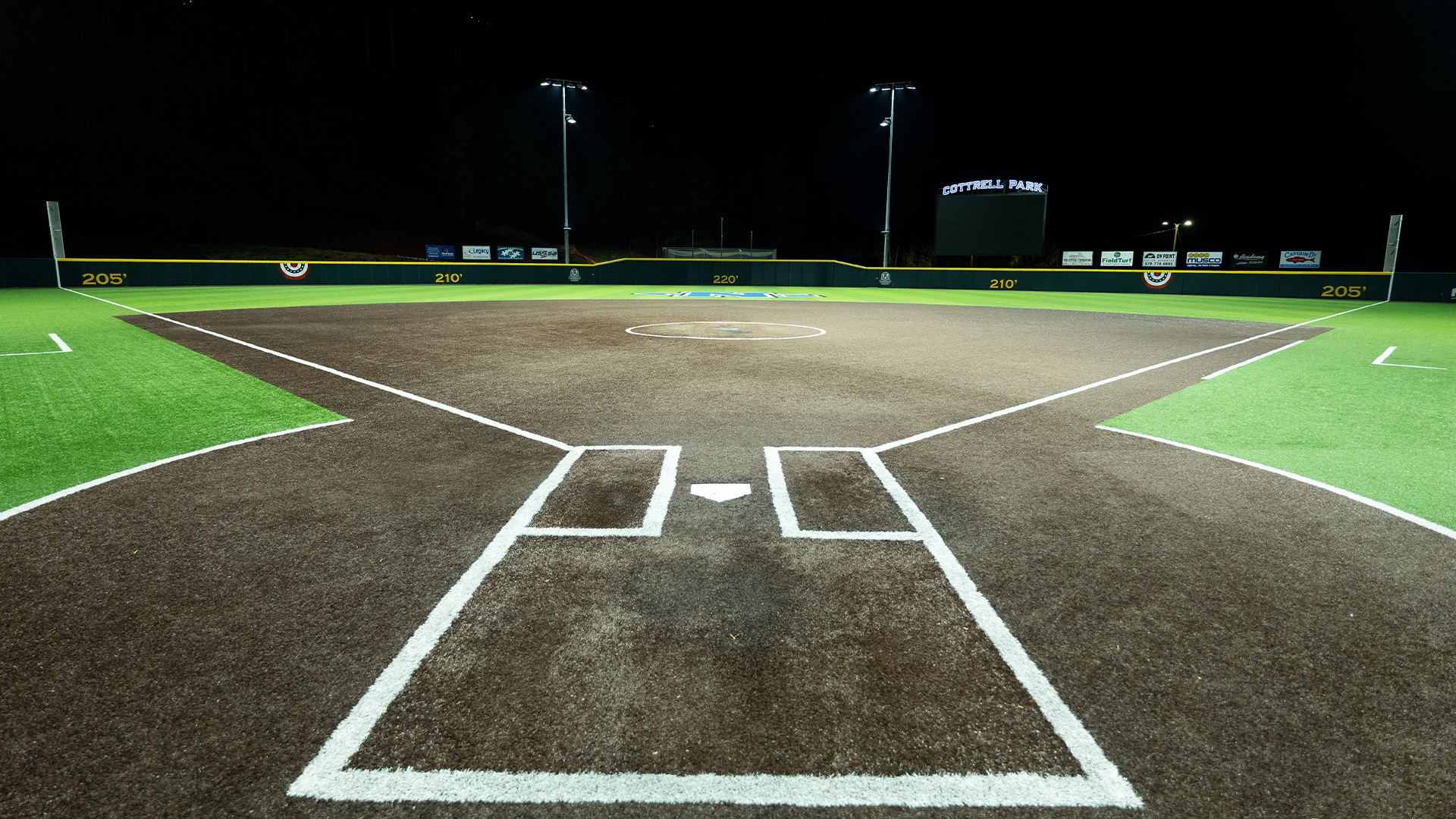 University of North Georgia softball field seen from the batter's box after retrofit to LED field lights.