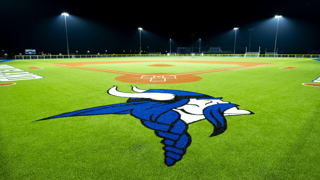 Grand Island CSD baseball field with viking team logo in foreground and Musco LED lighting in the background