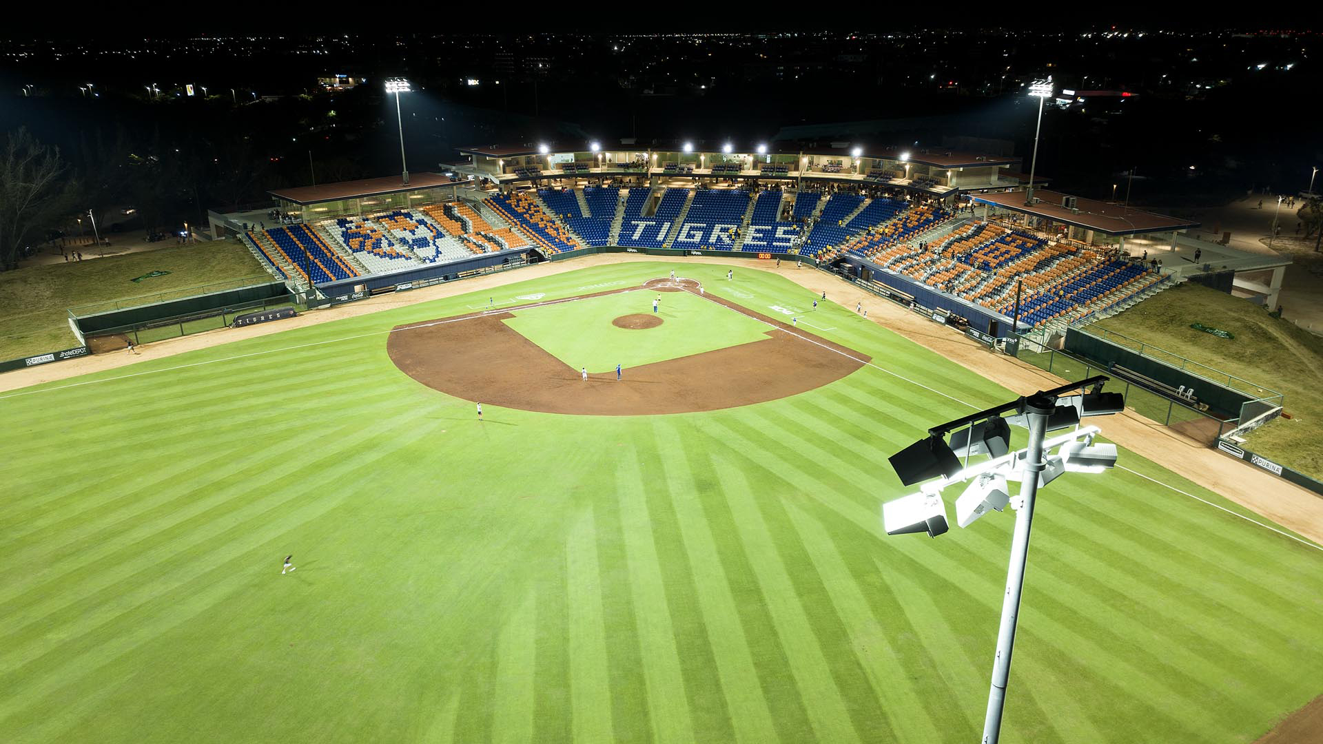 Baseball field at Estadio Beto Ávila with Musco LED sports lighting fixture in foreground