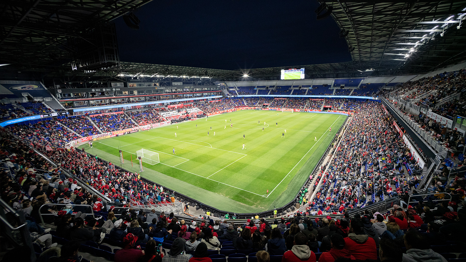 Soccer game at Red Bull Arena being played at night under new LED stadium lights.