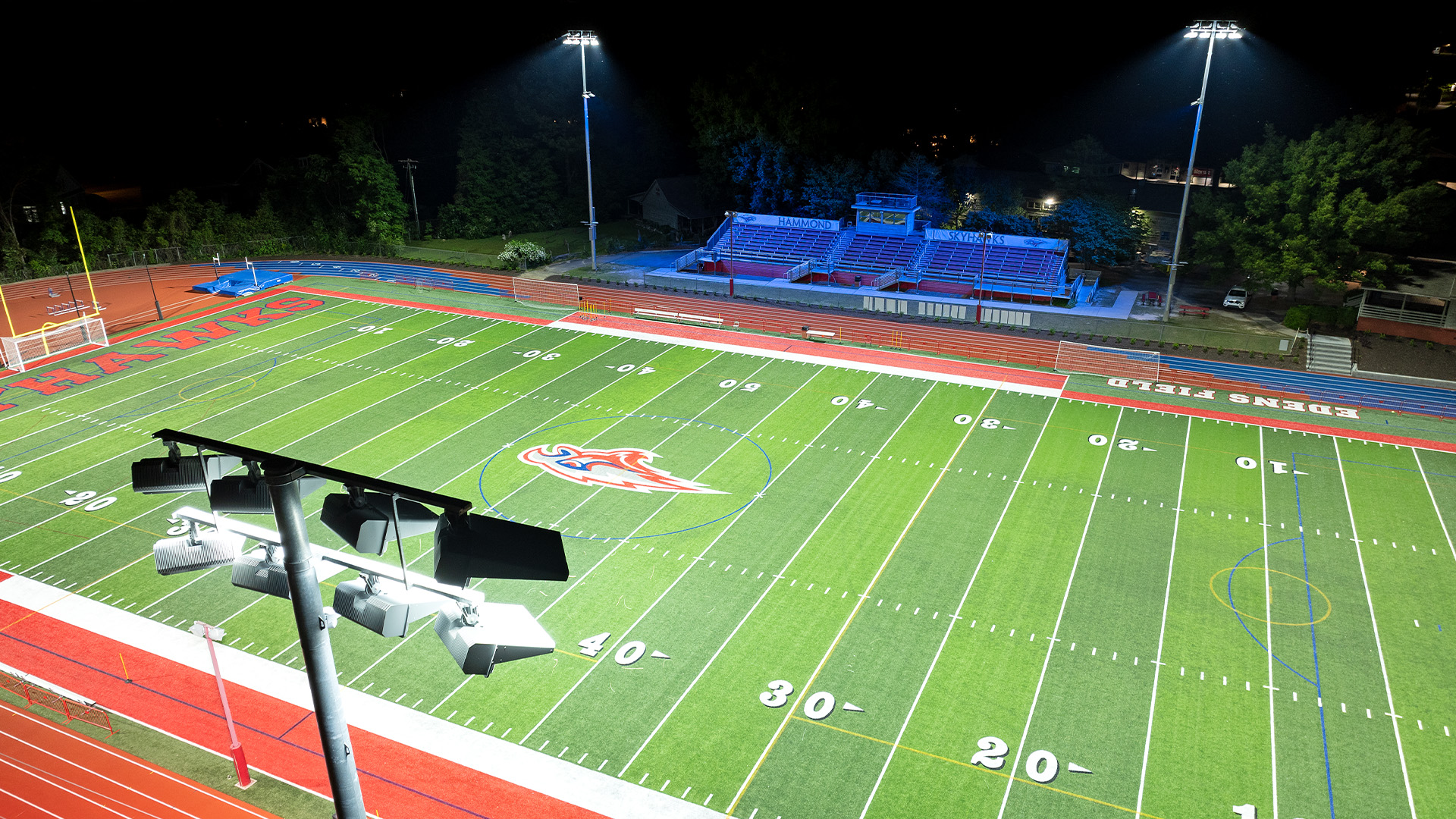 Hammond High School football field with Musco LED stadium lighting fixture in foreground.