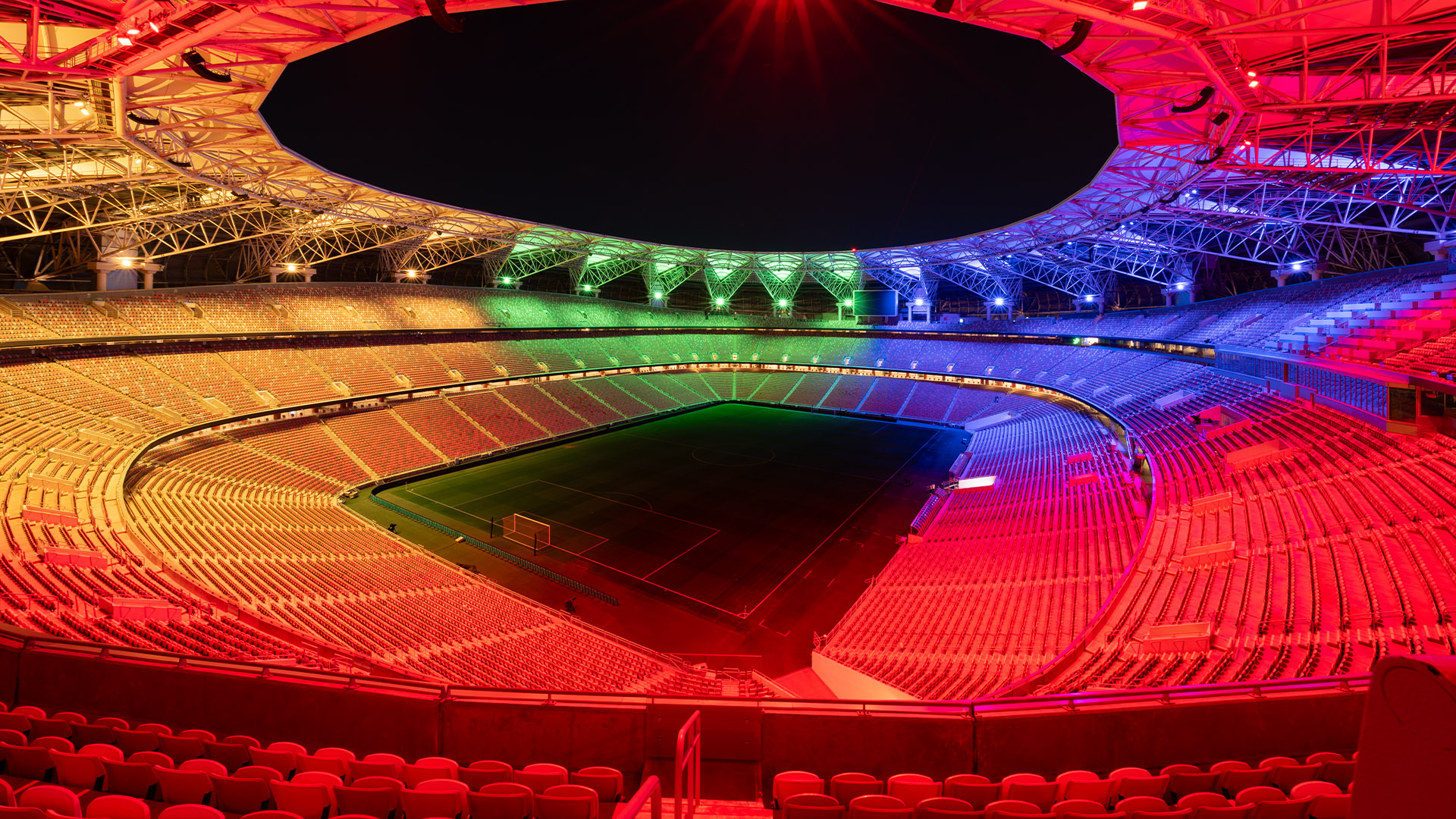 King Abdullah Stadium stands lit in green, blue, red and yellow with new LED light show technology.