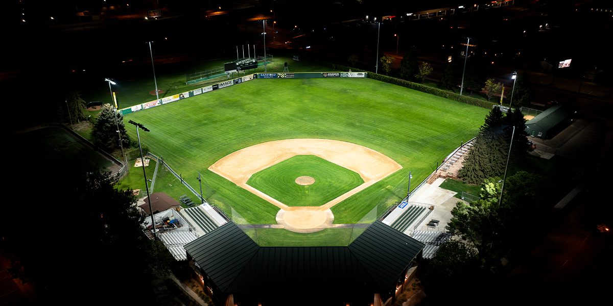 Night photo of the Bismark Municipal Ballpark taken from above and behind the dug out. The baseball field is lit with Musco's TLC for LED system. The baseball field is uniformly lit to appropriate light levels, while surrounding areas and property remain dark.