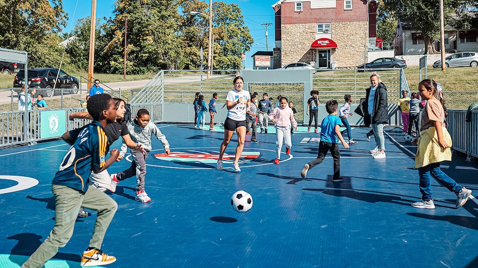 kids playing soccer outdoors