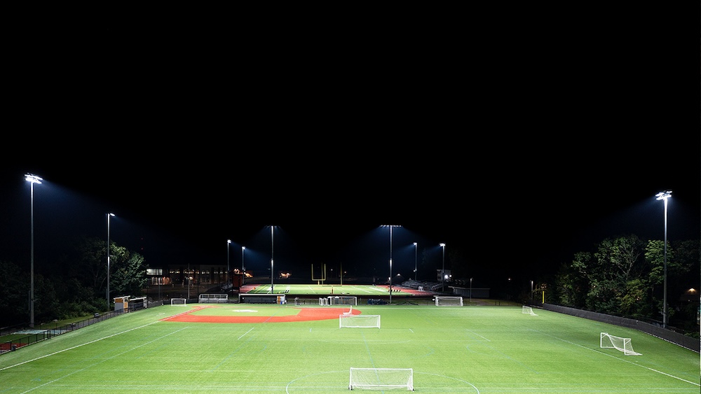 Soccer field lit by stadium lighting