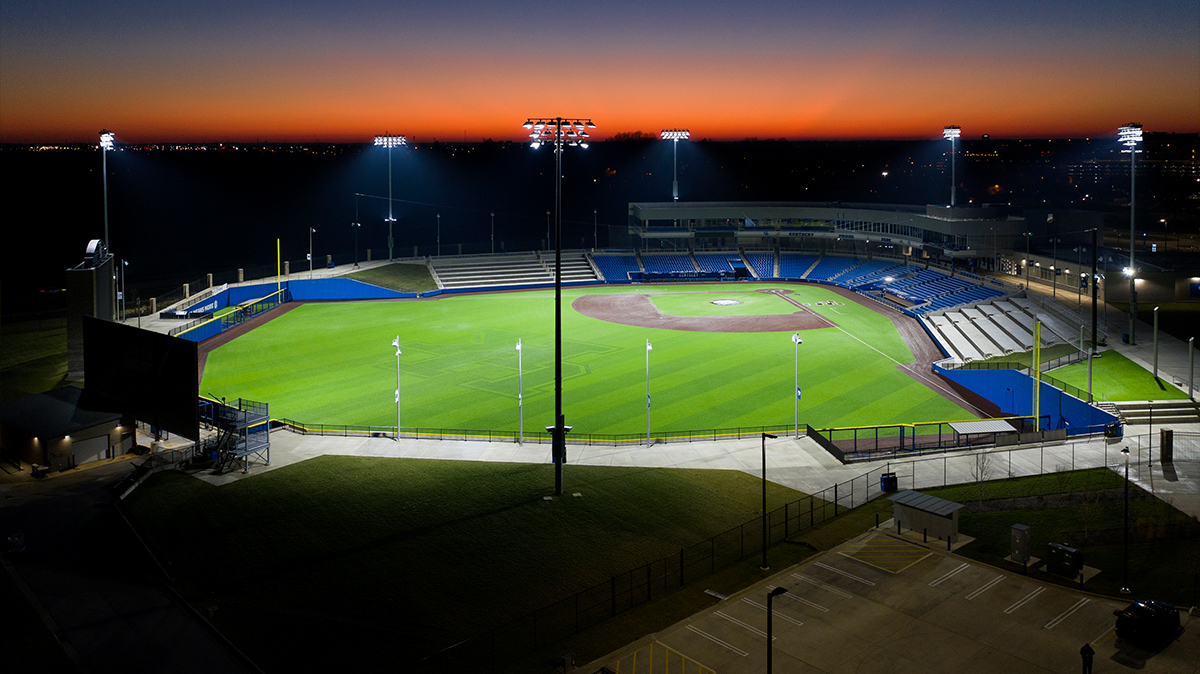 Lit baseball field view from the outfield