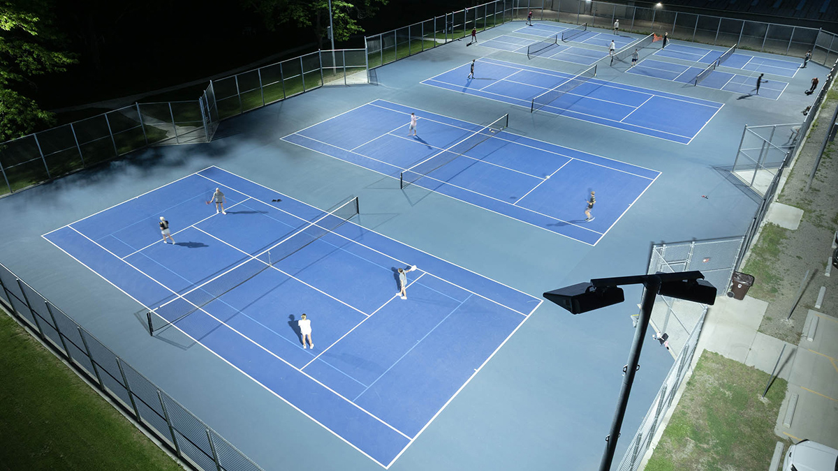 4 pickleball courts side-by-side with overhead lighting