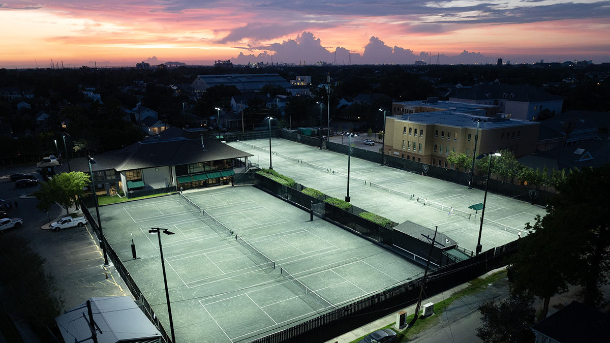 outdoor tennis court with sunset view